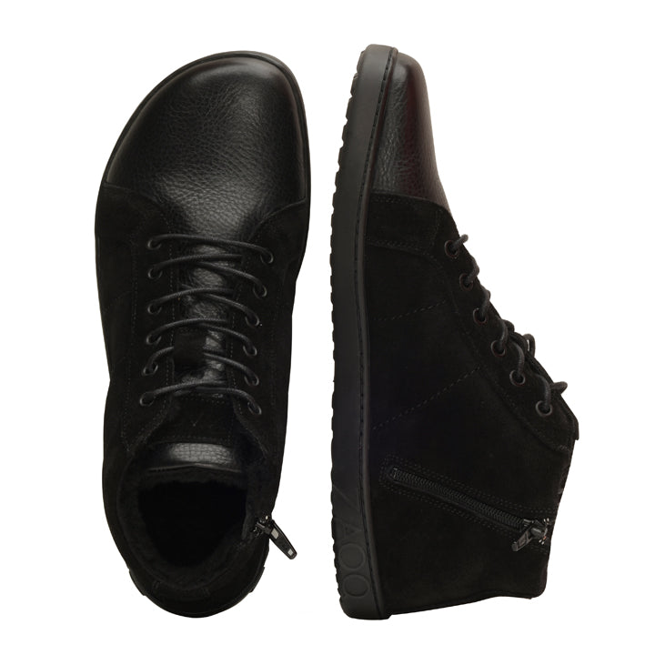 Introducing the QORE Mid Winter Black lace-up ankle boots from ZAQQ, Made from textured leather and with practical side zips and durable rubber soles. One boot is shown from above, while the other offers a side view to highlight its unique design and intricate details.
