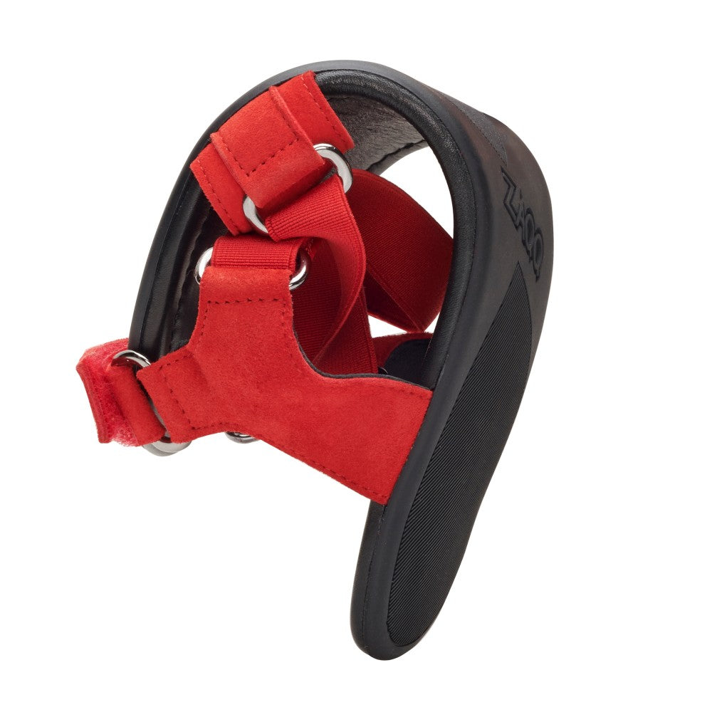 The MIQA Red dog boots from ZAQQ Designed for outdoor adventures, it features a sturdy rubber sole and adjustable straps that resemble a strappy system. Accented with silver metal loops for a secure fit, the boot is presented upright against a white background, highlighting its functionality and style.