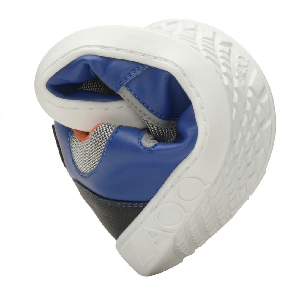 A close-up of the one bent in the middle ZAQQ QOPA Blue shoe that highlights its flexibility. The sole is white with a visible tread pattern and the outside is made of blue and black materials with touches of orange and breathable mesh.