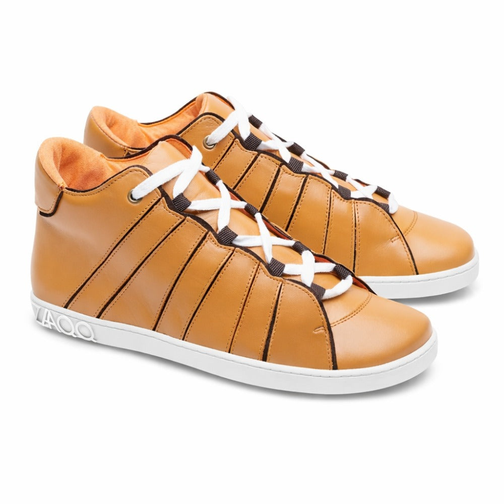 Introducing the QQQ Mid Sierra from ZAQQ: A pair of brown high-top sneakers made from supple nappa leather with contrasting white soles and laces. The inner lining is lined with orange fabric, which increases comfort. Stylish black stripe details decorate the sides and add an elegant touch.