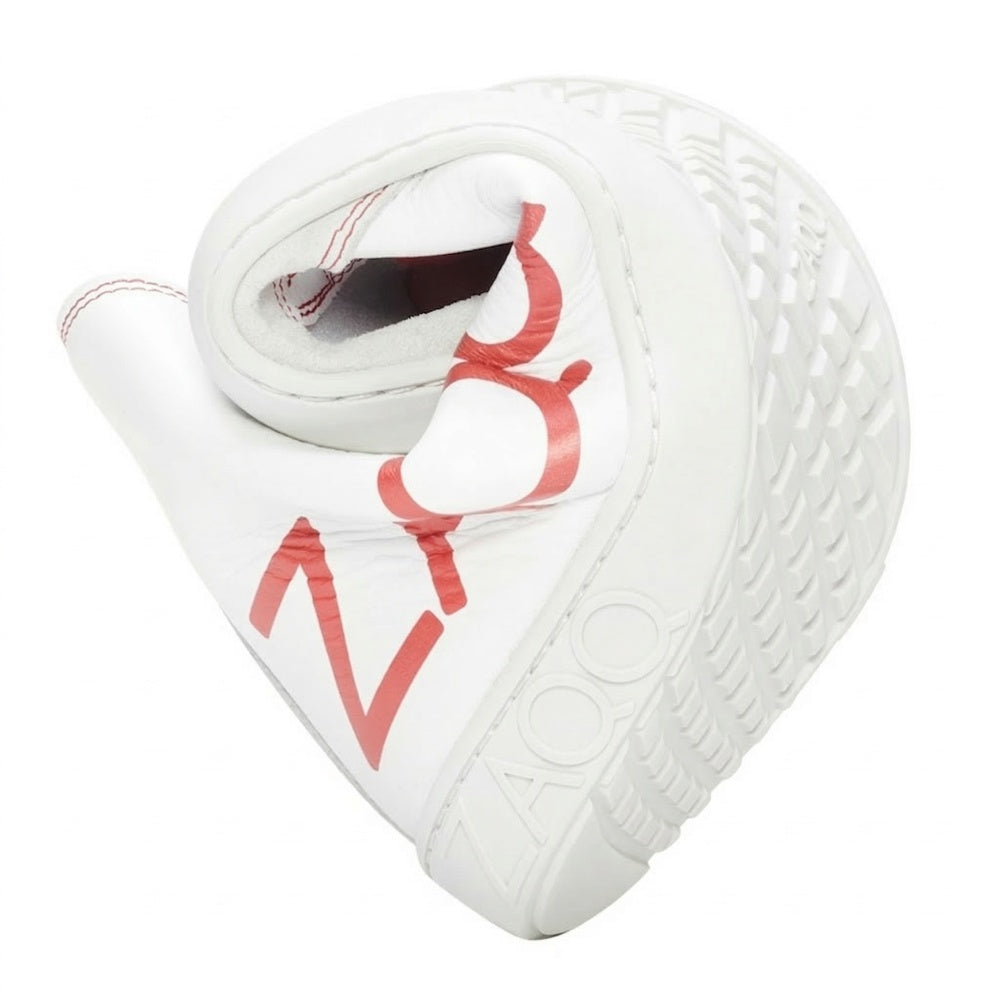 A twisted, heart-shaped object made from the material ZAQQ SQYLA White resembles an ultra-modern sneaker sole with a structured design and features the red letters ZOZO on its surface.