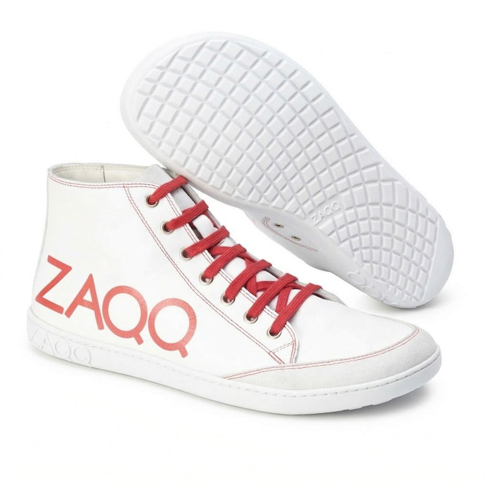 The SQYLA White high-top sneakers from ZAQQ are a modern option with striking red laces and stitching as well as the brand name printed in red ZAQQ on the side. The shoes feature textured soles for superior grip, showcased in style by presenting a shoe upside down to highlight its distinctive tread pattern.