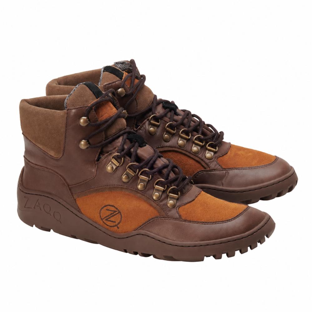 A pair of waterproof hiking boots TERRAQ Camel by ZAQQ in a brown-brown design with lace details and metal eyelets are perfect for any outdoor adventure. These durable boots have rugged soles and are adorned on the side with the round Z-logo, showcasing their TERRAQ quality and withstanding any trail.